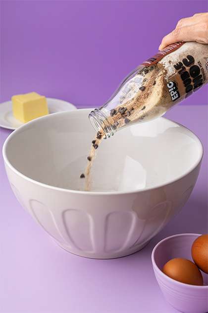 Brownie Mix poured into mixing bowl