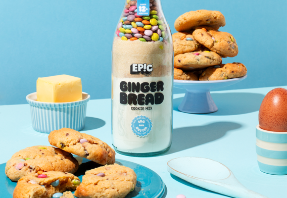 Gingerbread Cookie Mix Layered Bottle surrounded by rainbow gingerbread cookies