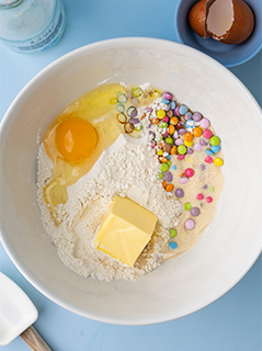 gingerbread mix in bowl with egg and butter
